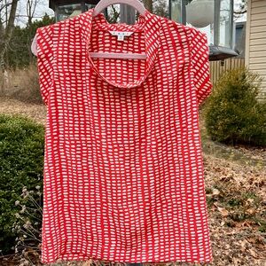 CAbi Madeleine top, orange with abstract cream dots